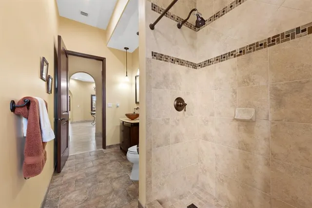 a view of a hallway with wooden floor and windows