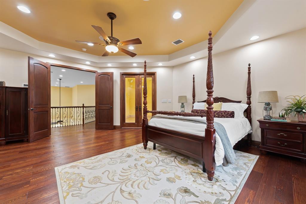11621 Southwest 1st Street Plantation, FL 33325 - Photo 28 of 47 a spacious bedroom with a bed a chandelier and couch