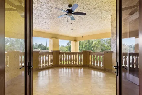 an aerial view of residential houses with outdoor space and swimming pool
