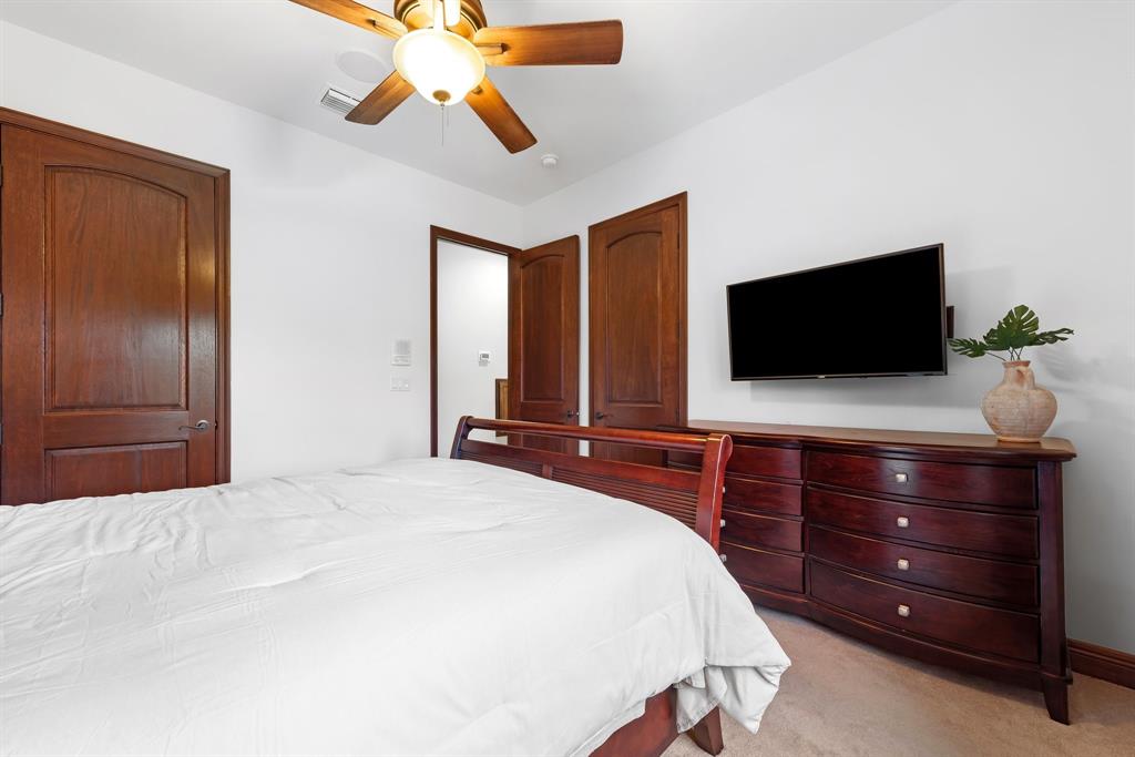 11621 Southwest 1st Street Plantation, FL 33325 - Photo 31 of 47 a bedroom with a bed and a flat screen tv