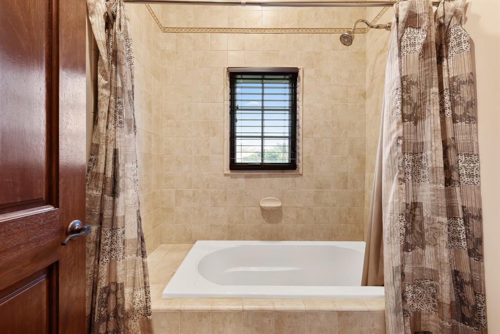 11621 Southwest 1st Street Plantation, FL 33325 - Photo 33 of 47 a bathroom with a bathtub and shower
