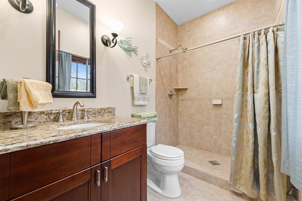 11621 Southwest 1st Street Plantation, FL 33325 - Photo 38 of 47 a bathroom with a granite countertop sink toilet and shower