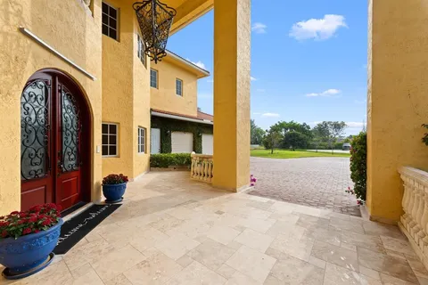 a view of swimming pool with a outdoor seating