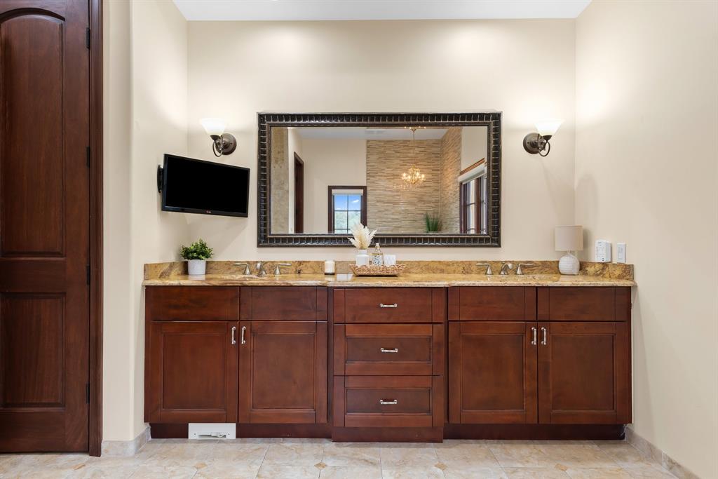 11621 Southwest 1st Street Plantation, FL 33325 - Photo 41 of 47 a bathroom with a granite countertop sink vanity and mirror