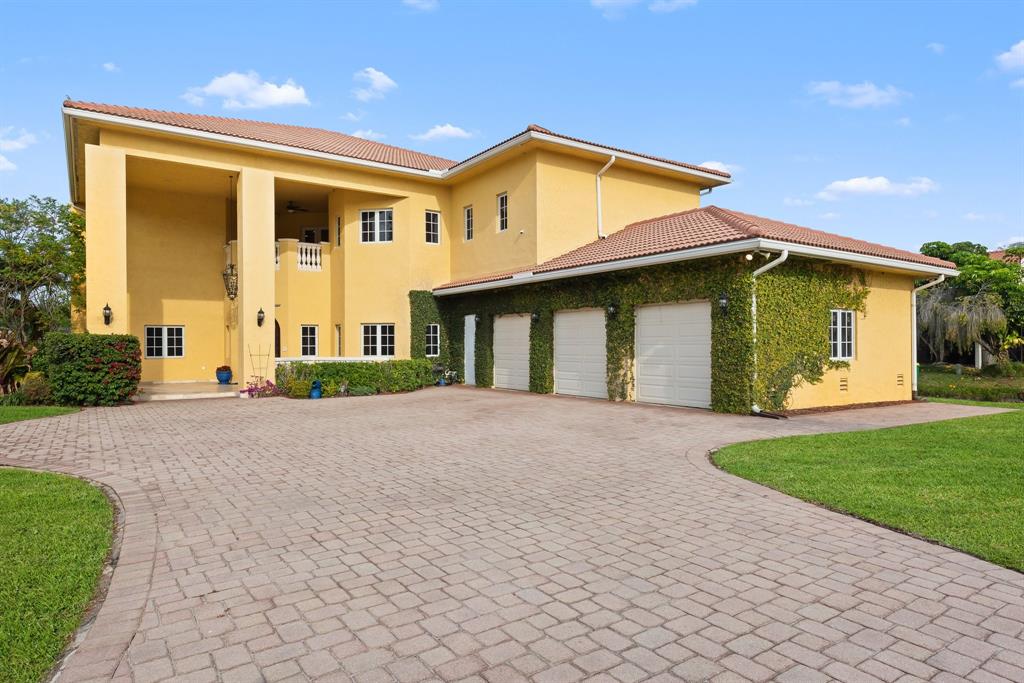 11621 Southwest 1st Street Plantation, FL 33325 - Photo 44 of 47 a view of a house with a yard and potted plants