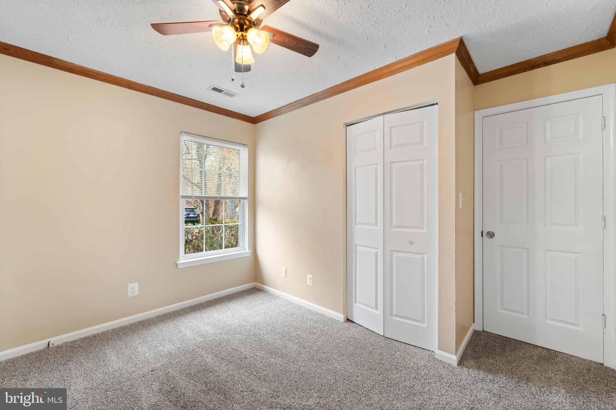 659 San Gabriel Road Lusby, MD 20657 - Photo 15 of 20 an empty room with windows and fan