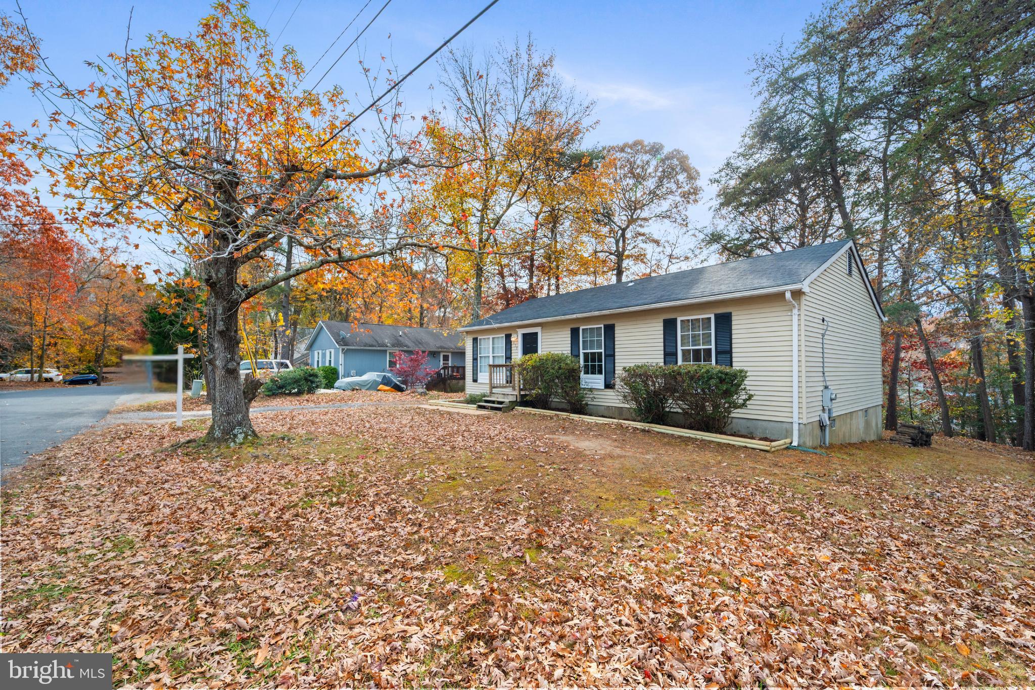 659 San Gabriel Road Lusby, MD 20657 - Photo 20 of 20 a view of a house with a yard covered in snow