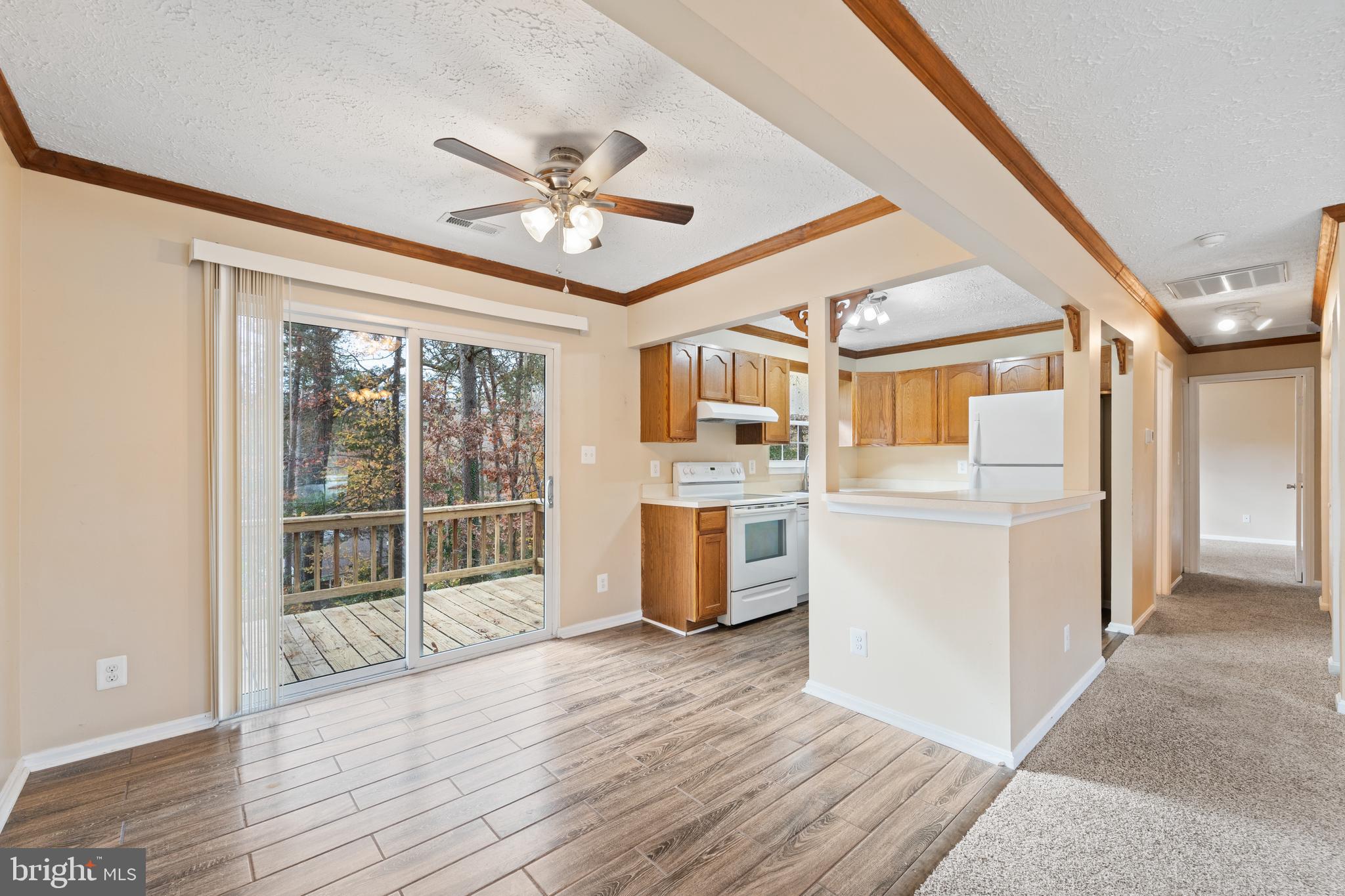 659 San Gabriel Road Lusby, MD 20657 - Photo 3 of 20 a view of a kitchen with furniture and wooden floor