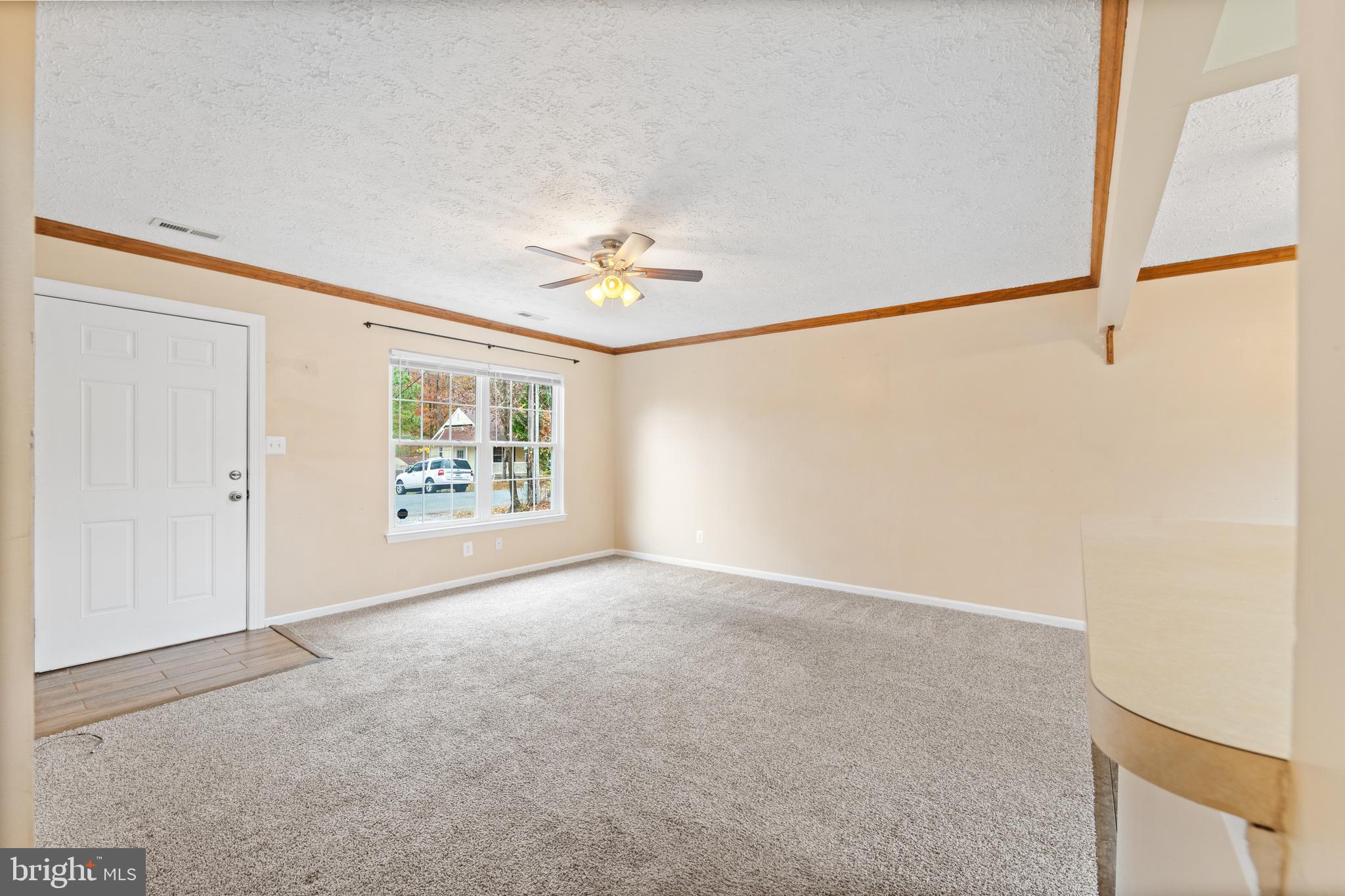 659 San Gabriel Road Lusby, MD 20657 - Photo 10 of 20 an empty room with windows and fan