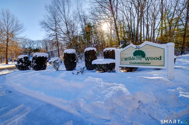 a view of a car park in front of house