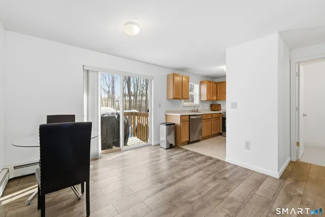 a view of a kitchen with furniture and a window