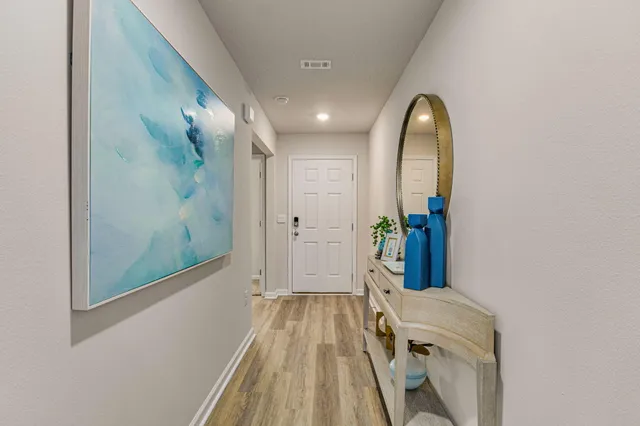 a view of a hallway with entryway