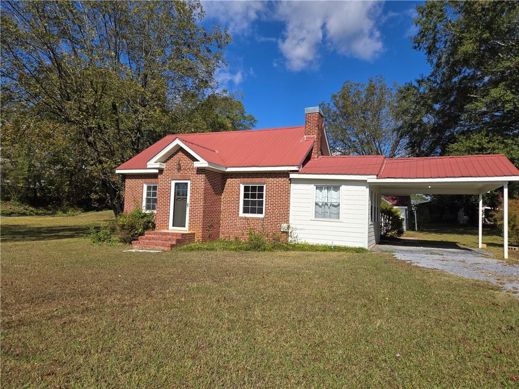 11954 Fairmount Highway Southeast Fairmount, GA 30139 - Photo 1 of 9 a front view of a house with a yard