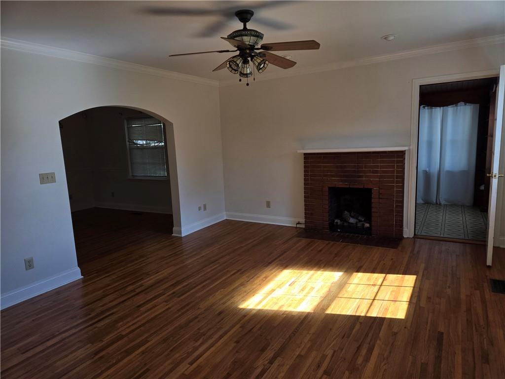 11954 Fairmount Highway Southeast Fairmount, GA 30139 - Photo 4 of 9 a living room with furniture and a fireplace