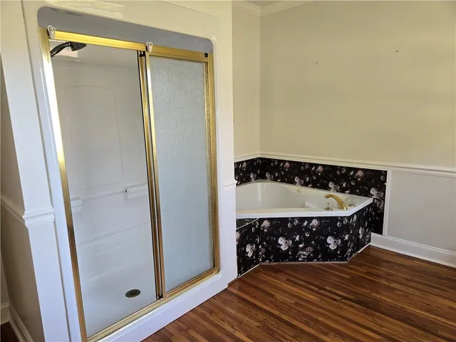 a view of a utility room with wooden floor