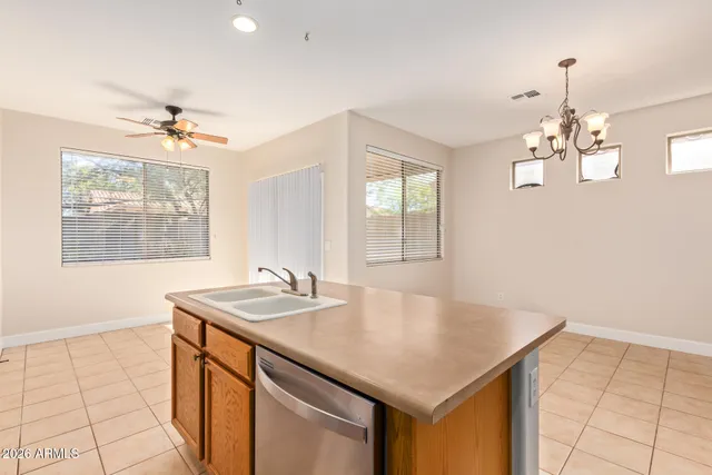 a kitchen with sink cabinets and window