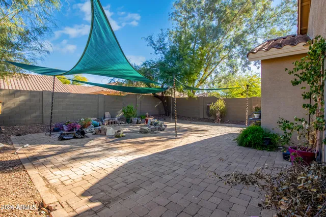 a view of a chairs and table in the patio