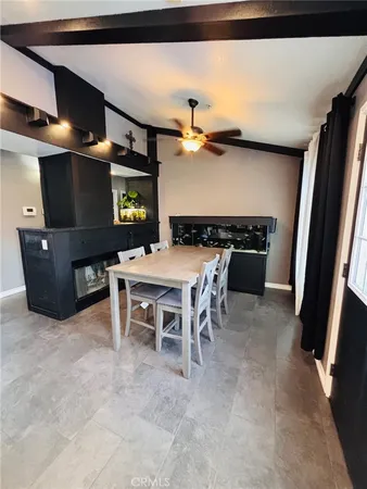 a view of utility room with washer and fireplace