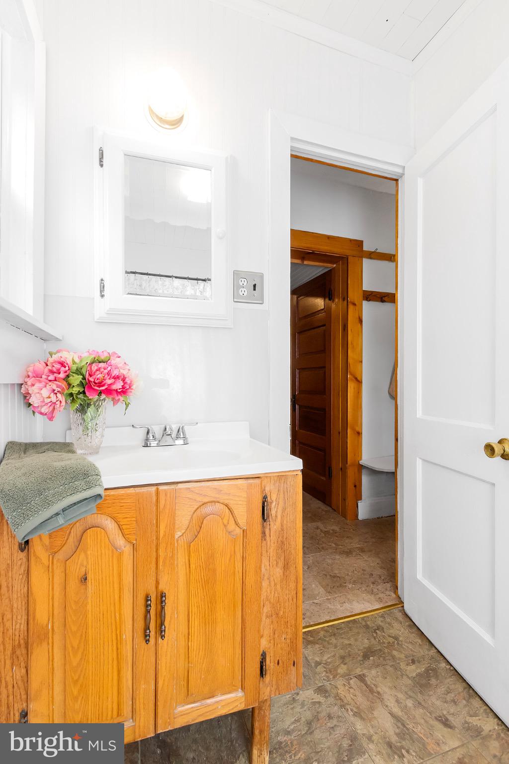 2485 Potomac Road Berkeley Springs, WV 25411 - Photo 20 of 60 Charming bathroom with vintage wooden accents.