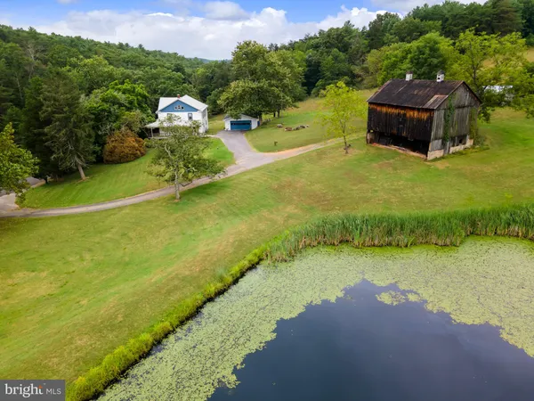 a view of a lake with a yard