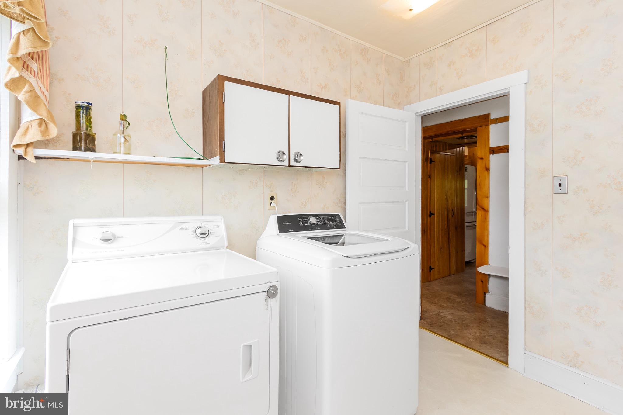2485 Potomac Road Berkeley Springs, WV 25411 - Photo 22 of 60 a utility room with dryer and washer
