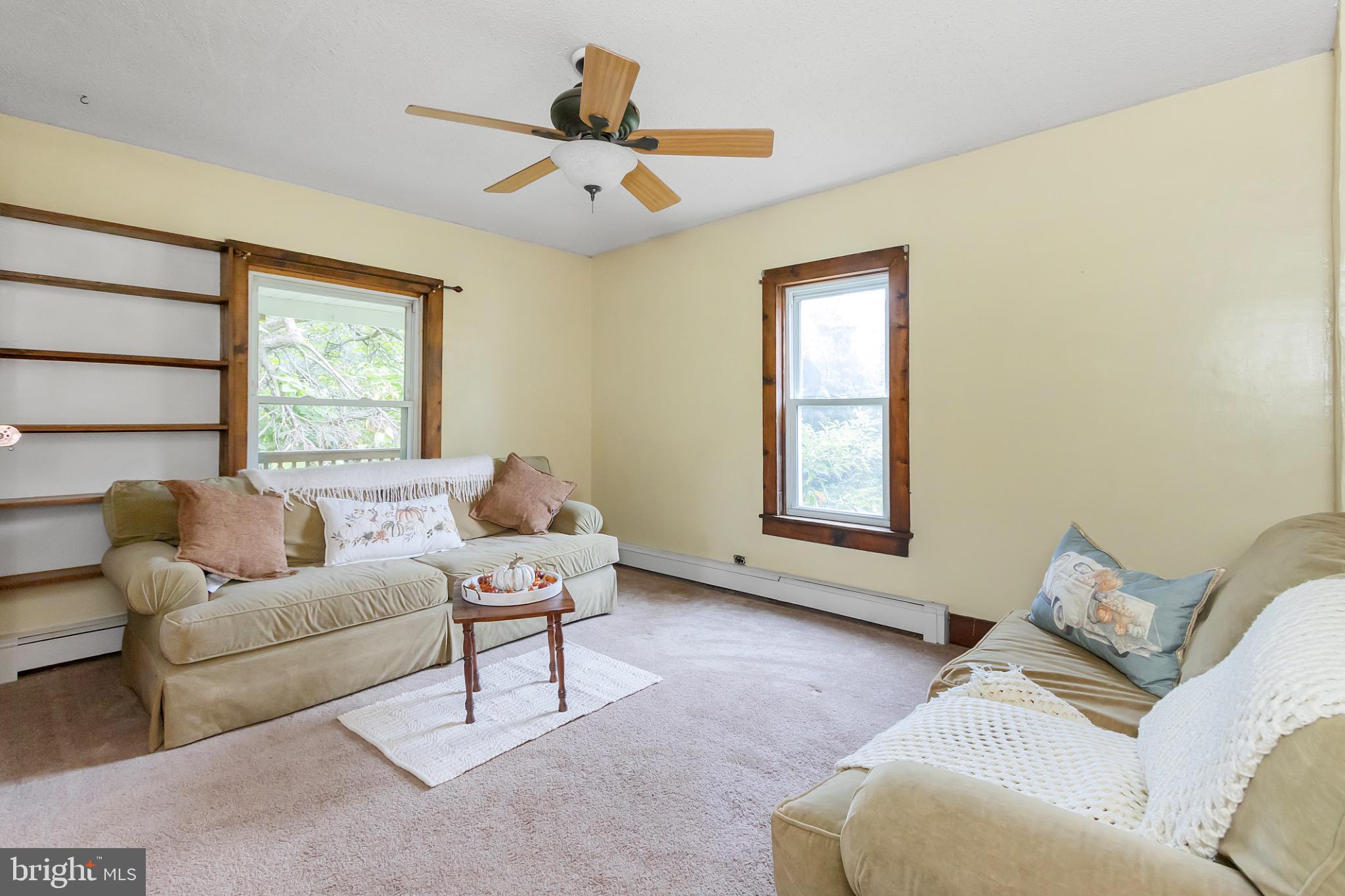 2485 Potomac Road Berkeley Springs, WV 25411 - Photo 23 of 60 a living room with furniture and a window