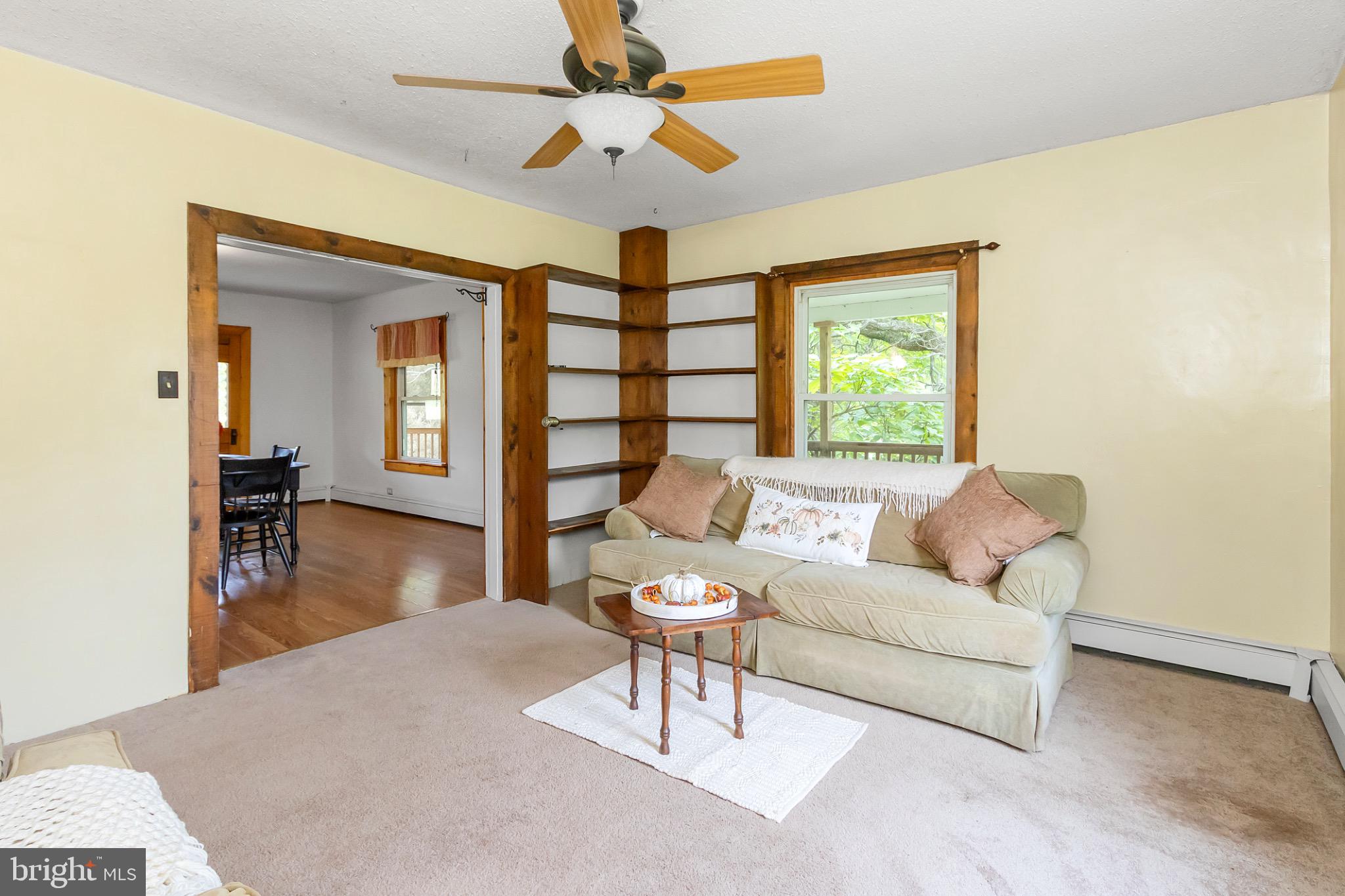 2485 Potomac Road Berkeley Springs, WV 25411 - Photo 24 of 60 a living room with furniture and a wooden floor