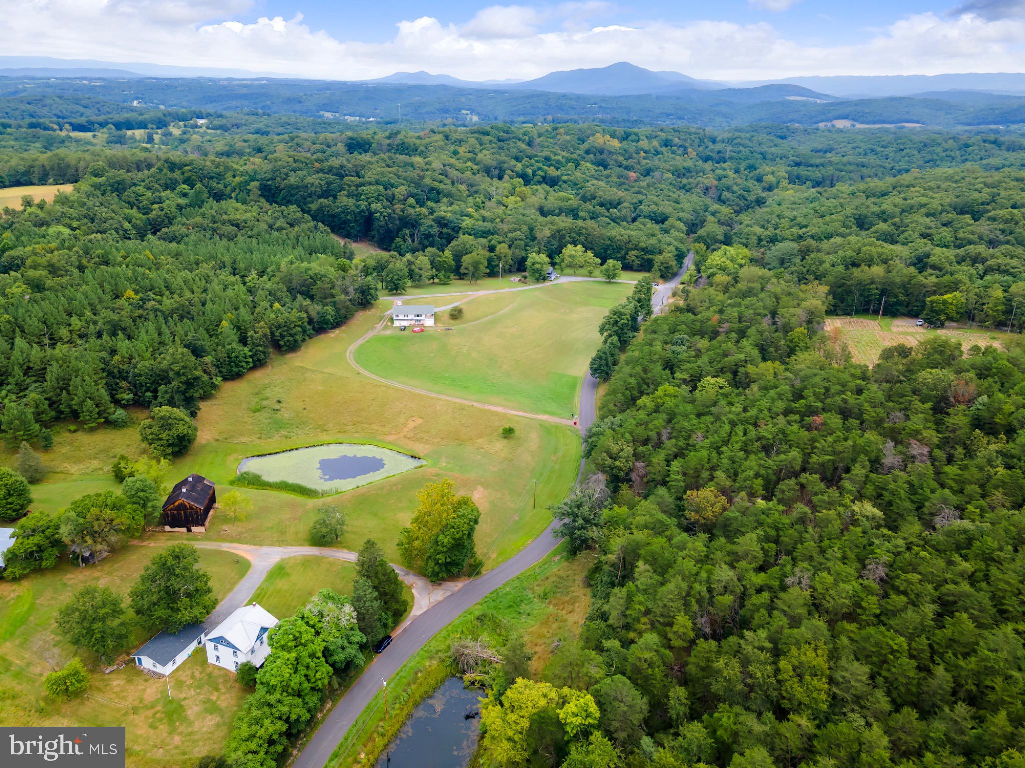 2485 Potomac Road Berkeley Springs, WV 25411 - Photo 3 of 60 Serene countryside retreat with lush landscapes.