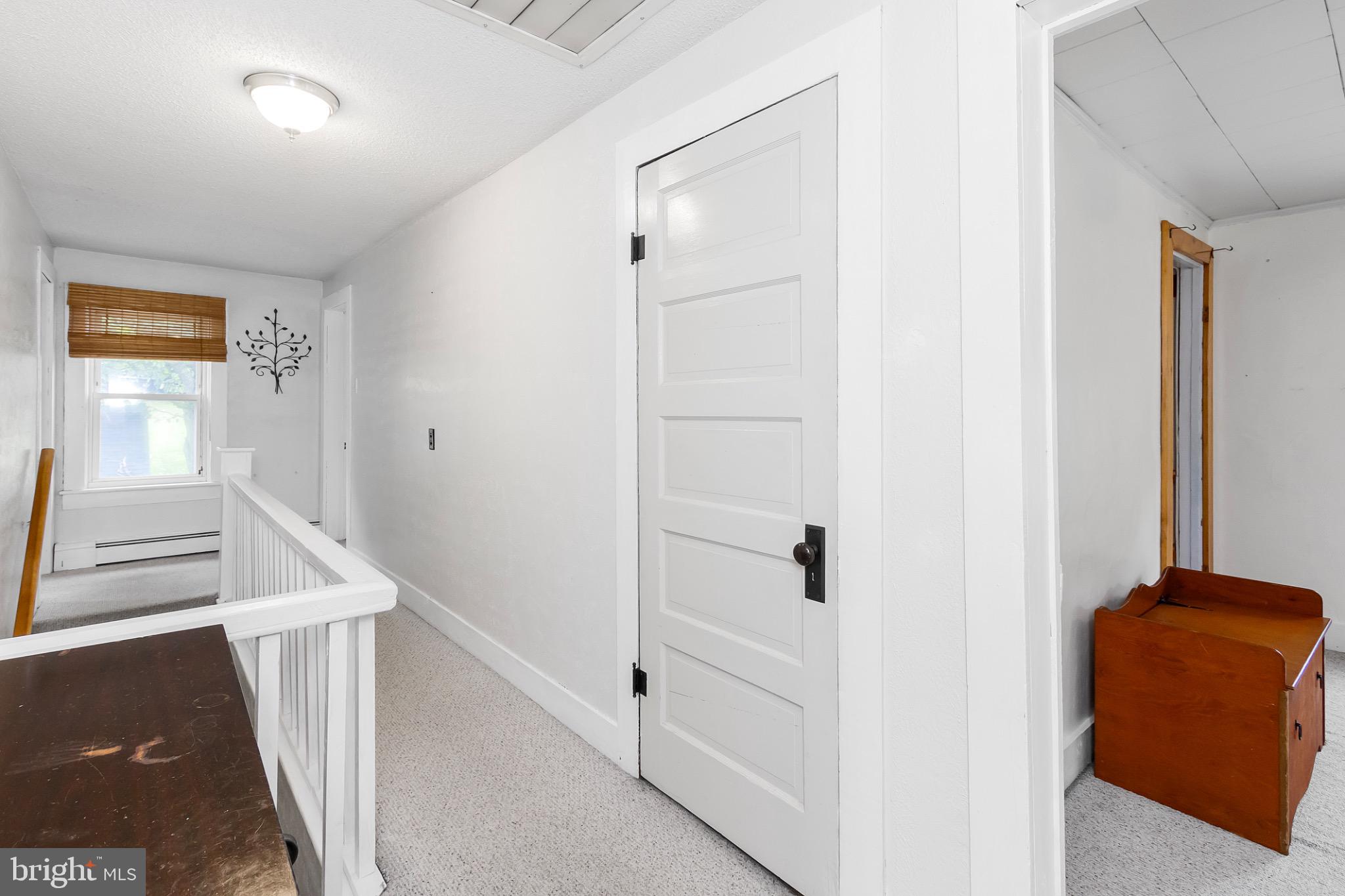 2485 Potomac Road Berkeley Springs, WV 25411 - Photo 45 of 60 a view of hallway with stairs and a closet