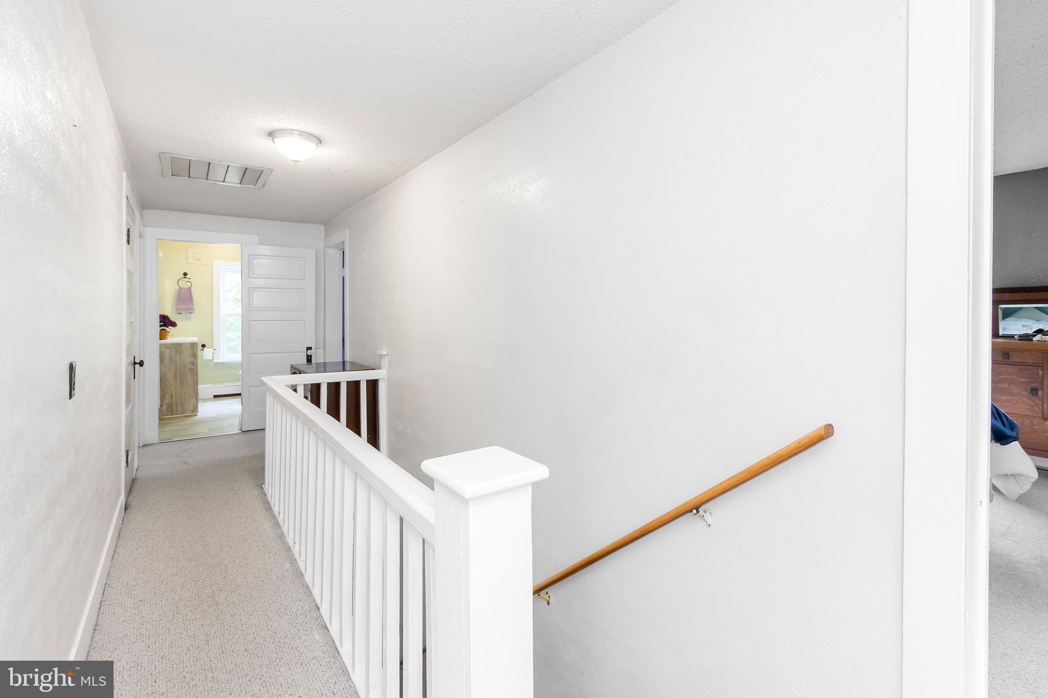 2485 Potomac Road Berkeley Springs, WV 25411 - Photo 46 of 60 a view of a hallway with windows