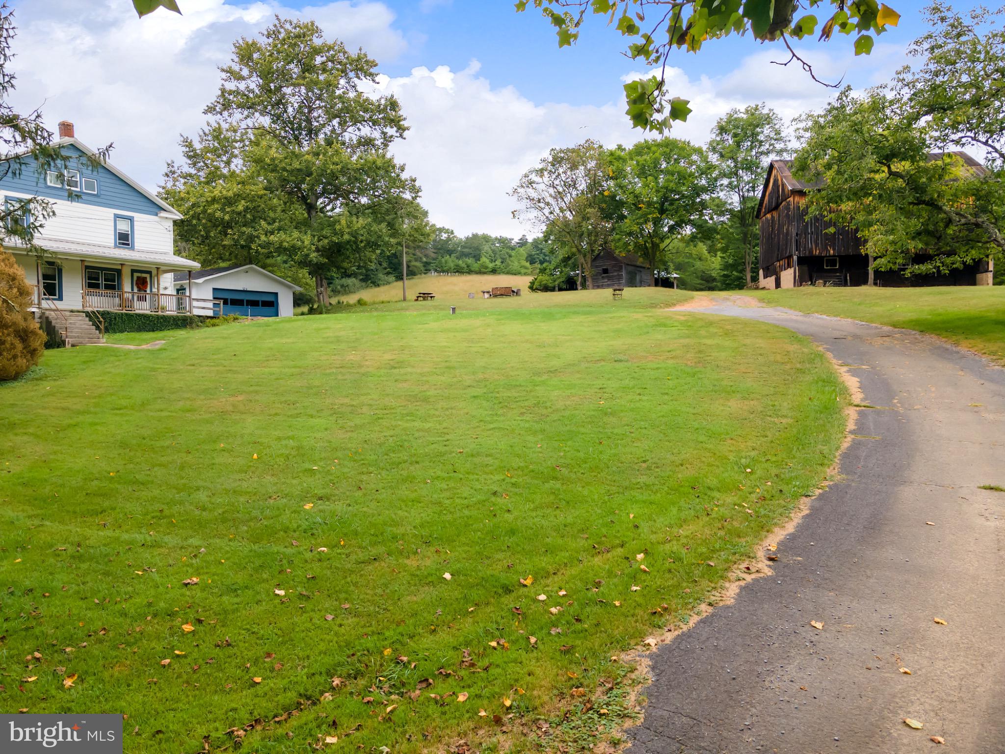 2485 Potomac Road Berkeley Springs, WV 25411 - Photo 50 of 60 a view of a house with a big yard