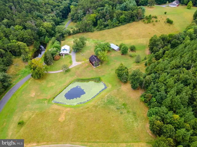 a bathroom with a sink mirror and vanity