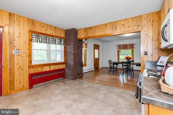 a kitchen with stainless steel appliances granite countertop a stove and cabinets