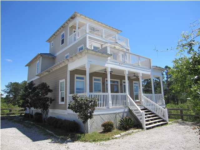 6272 Co Road Santa Rosa Beach, FL 32459 - Photo 1 of 19 a front view of a building with plants
