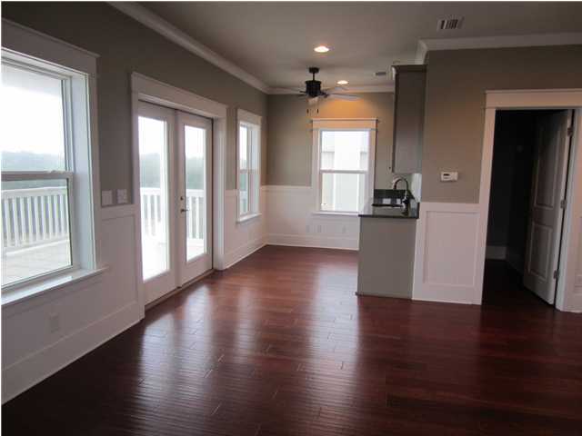 6272 Co Road Santa Rosa Beach, FL 32459 - Photo 14 of 19 an empty room with wooden floor and windows