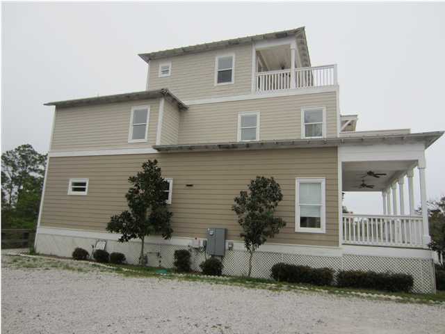 6272 Co Road Santa Rosa Beach, FL 32459 - Photo 19 of 19 a front view of a house with a yard