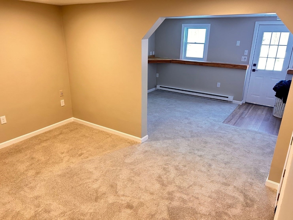 109 Blackstone Street, Unit 109 Bellingham, MA 02019 - Photo 15 of 15 an empty room with windows
