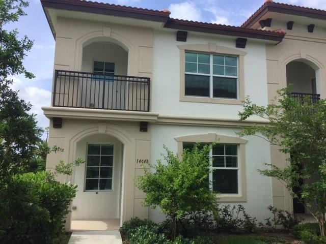 a view of front door and potted plants