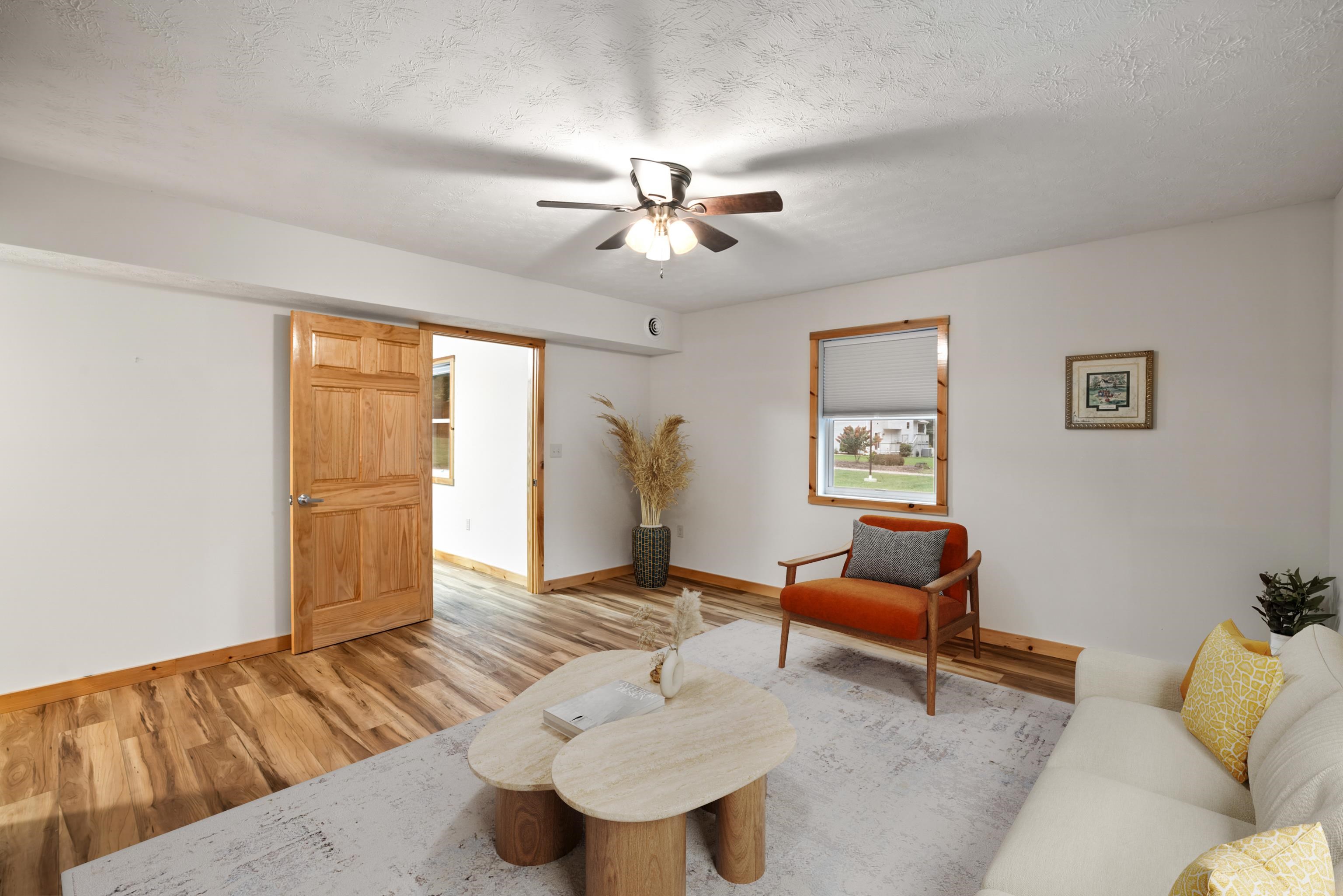 232 Old Back Road Raphine, VA 24472 - Photo 20 of 62 a living room with furniture and a chandelier