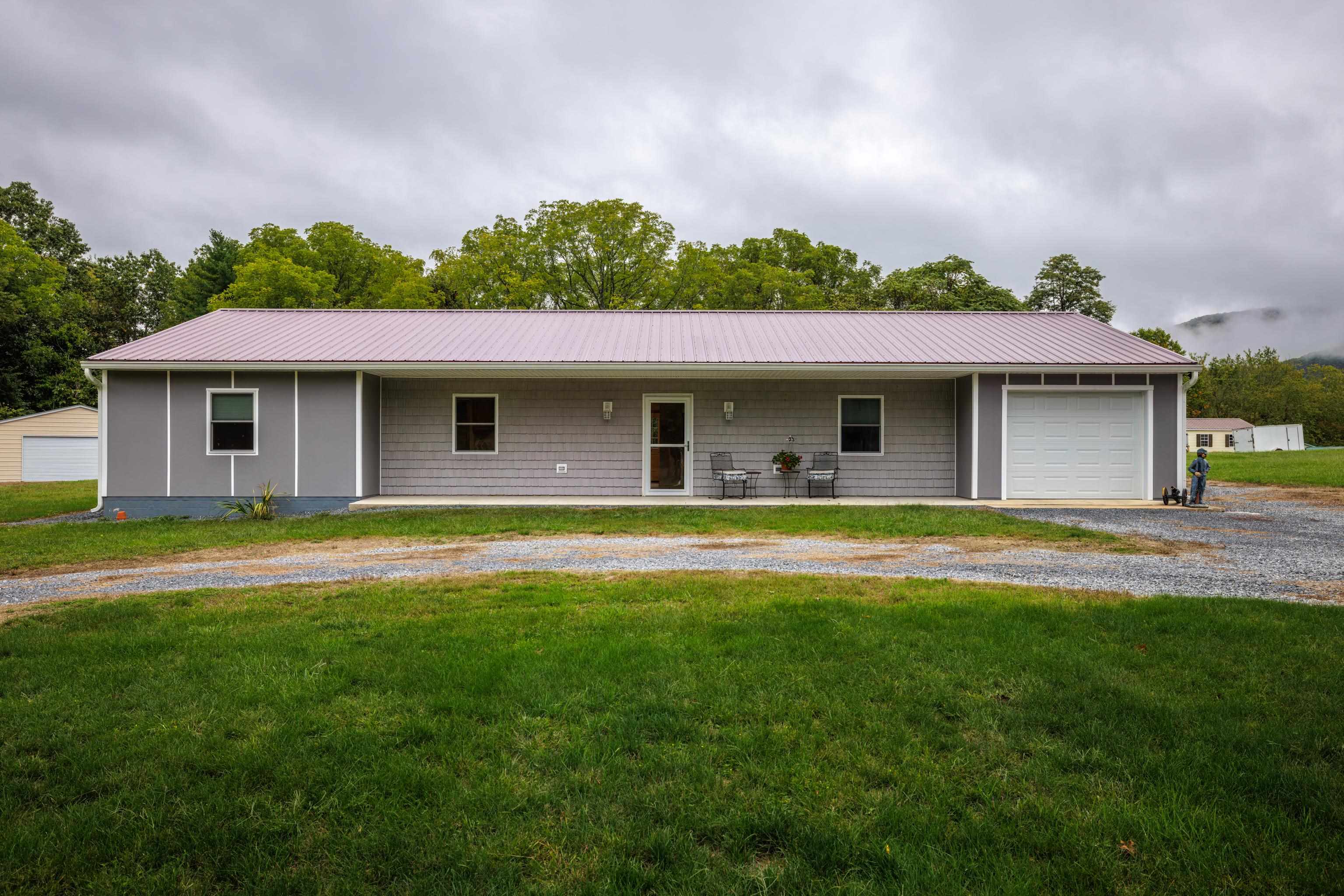 232 Old Back Road Raphine, VA 24472 - Photo 2 of 62 a front view of a house with a garden