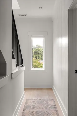 a view of a hallway with washer and dryer