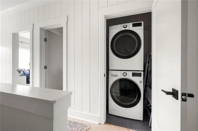 a view of a hallway with window and stairs