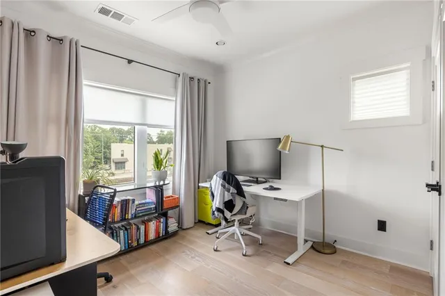a bathroom with a granite countertop sink mirror toilet and bathtub