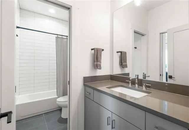 a view of staircase with white walls and a window