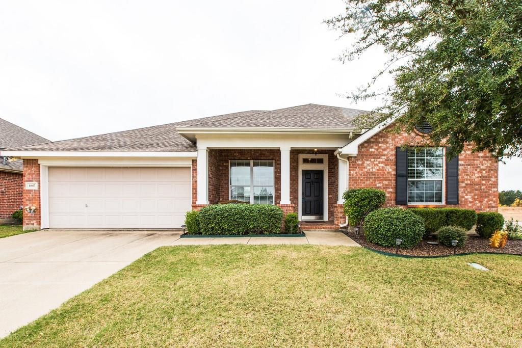 1007 Rio Frio Drive Forney, TX 75126 - Photo 1 of 1 a front view of a house with garden