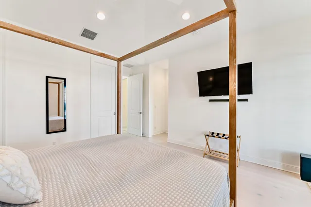 a bathroom with a granite countertop sink a mirror and a shower
