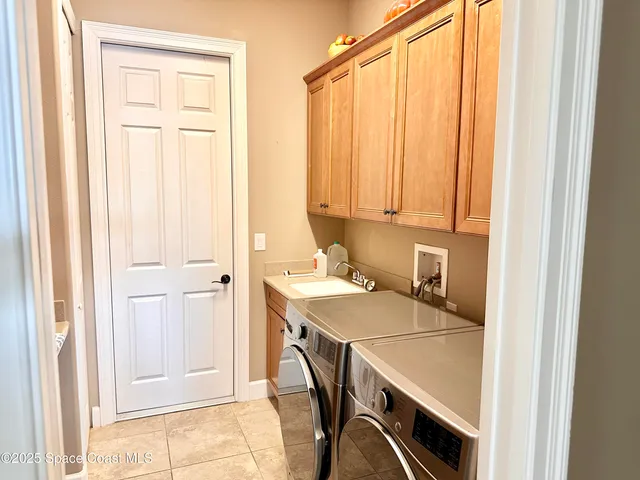 a room that has a bed and a table in it