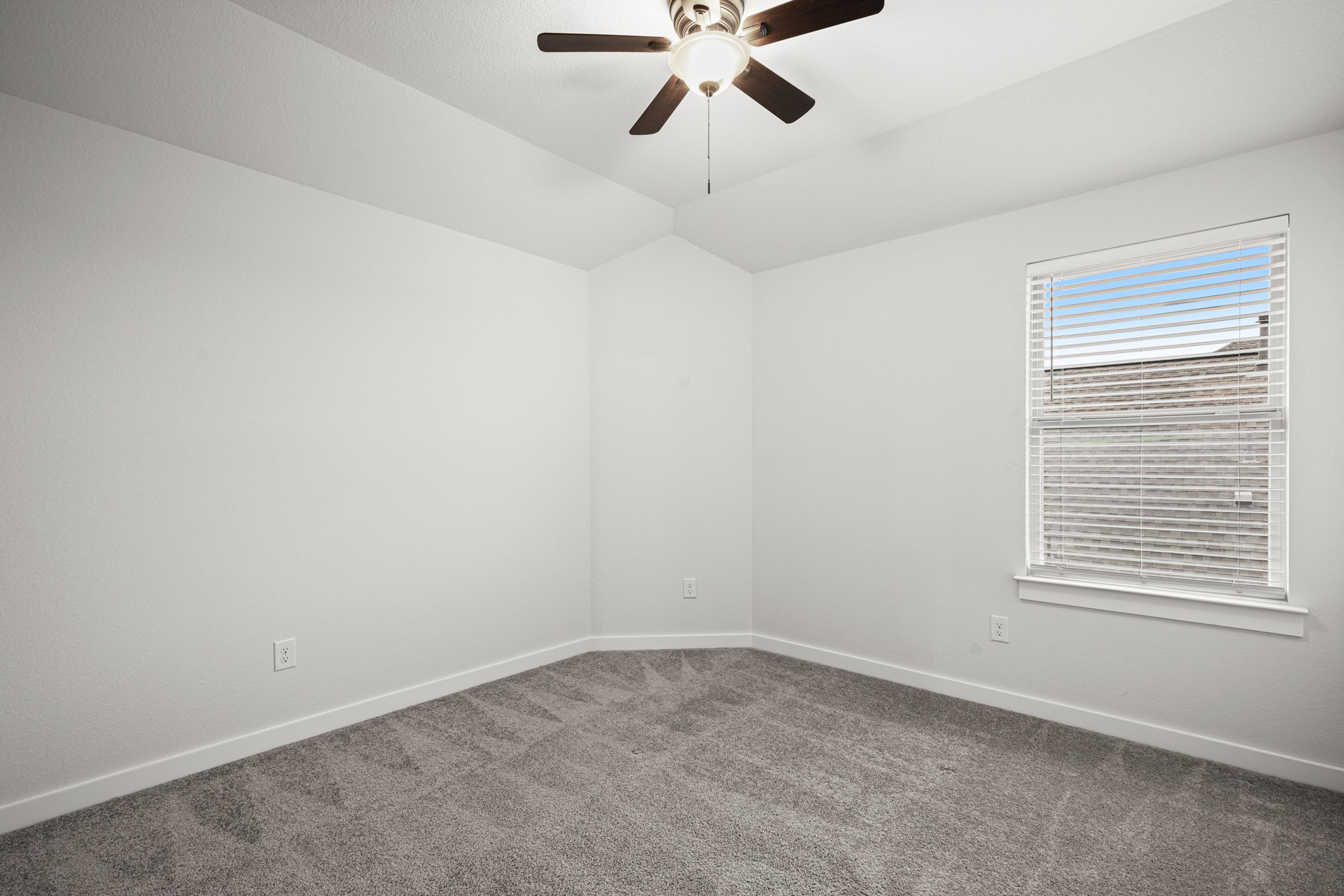 841 Spinnaker Loop Kyle, TX 78640 - Photo 30 of 40 Spare room featuring carpet flooring, lofted ceiling, and ceiling fan