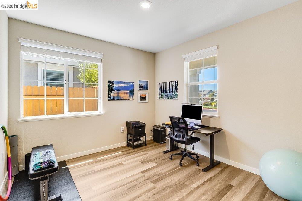 4347 Canada Way Rio Vista, CA 94571 - Photo 7 of 41 Versatile room with wood-finish flooring, two large windows, recessed lighting, and light-toned walls