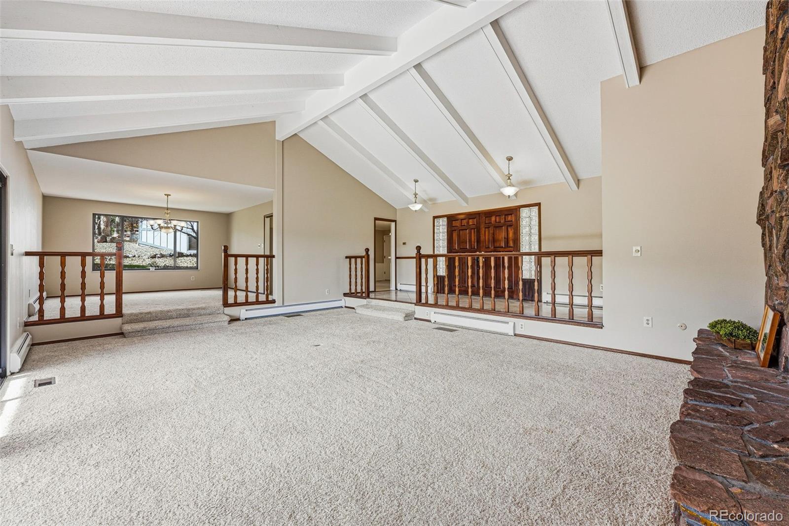 16066 Ridge Tee Drive Morrison, CO 80465 - Photo 18 of 41 a view of an empty room with chandelier fan